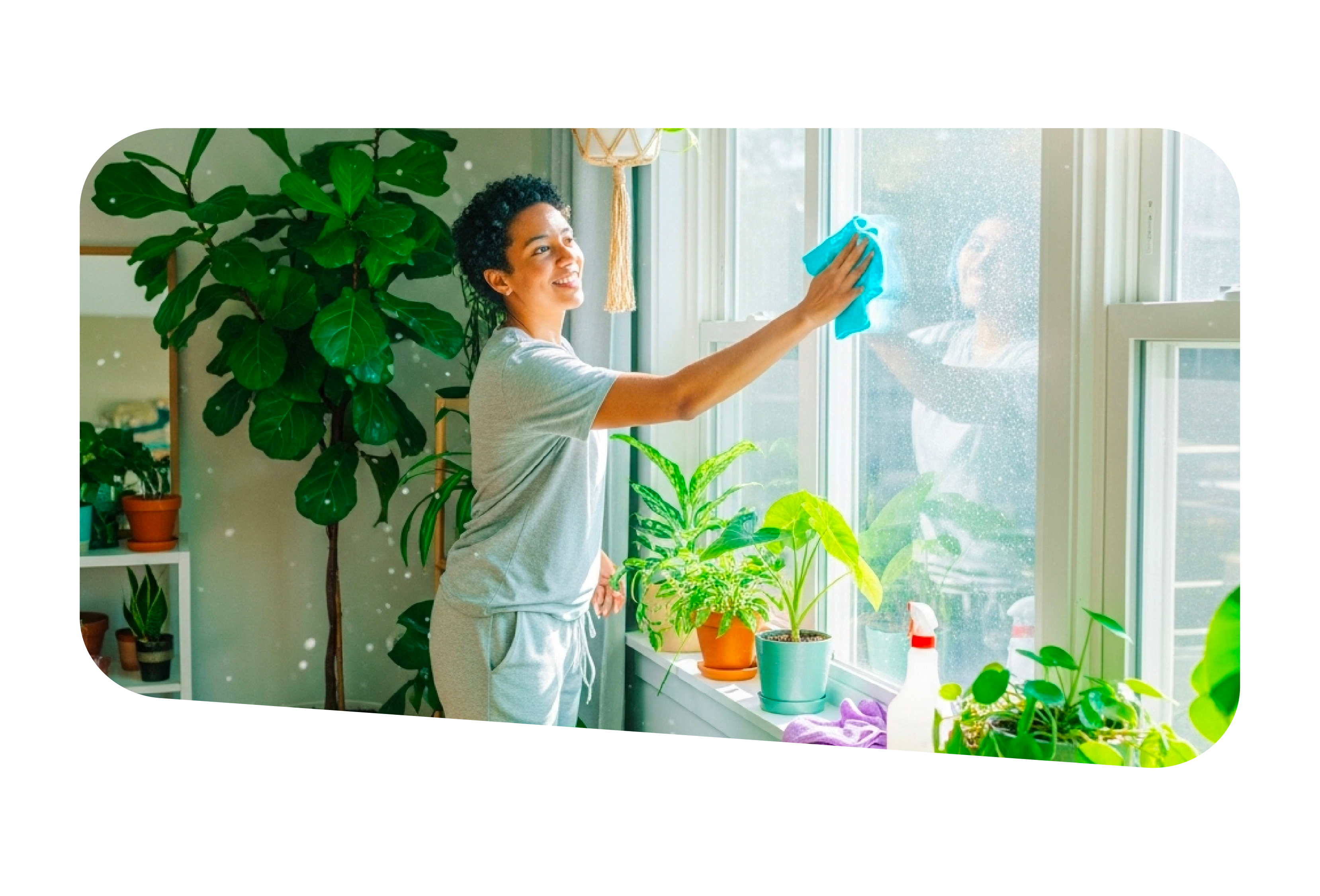 Person cleaning a bright window, representing spring cleaning.